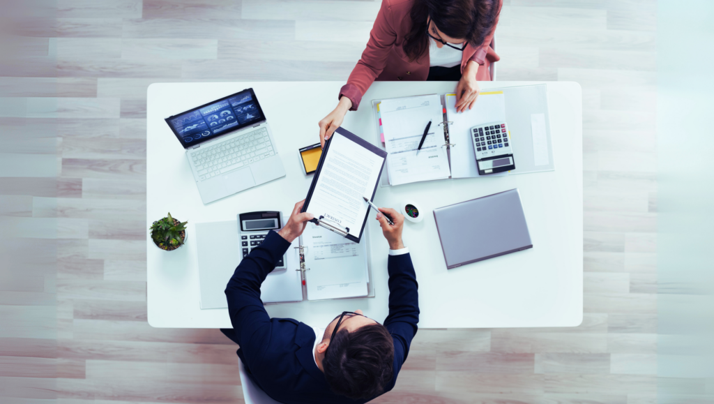 two people discussing brand documents