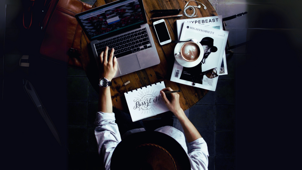 a woman drawing out typography text